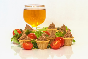 tartlets with liver pate decorated with lettuce and cherry tomatoes