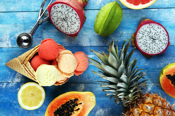 Fototapeta na wymiar Tropical fruits background, many colorful ripe fresh tropical fruits