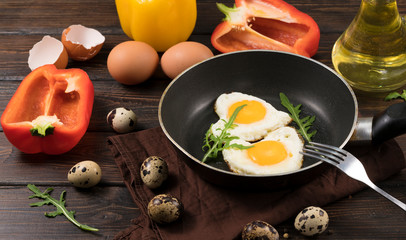 fried eggs in the shape of a heart in a skillet