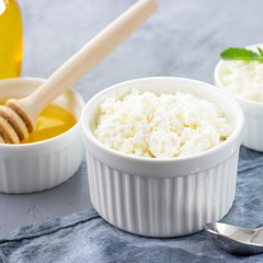 Healthy eat concept - breakfast with cottage cheese or ricotta with honey.