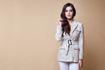 Sexy beautiful woman fashion glamour model brunette hair makeup wear silk blouse trousers jacket...