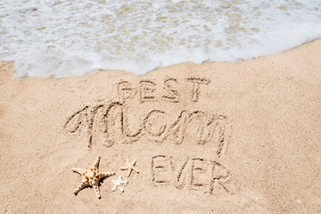 Happy Mothers day beach background with handwritten lettering Best Mom ever