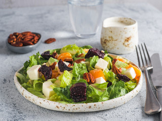 Beetroot, Feta Cheese and Orange Salad. Close up. Copy space for text. Gray concrete background