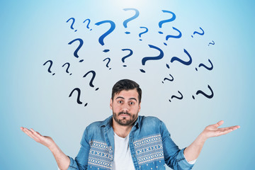 Confused man, black question marks