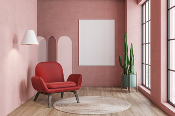 Pink living room with poster and armchair