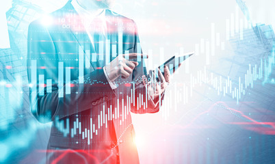 Man using tablet computer, virtual graph