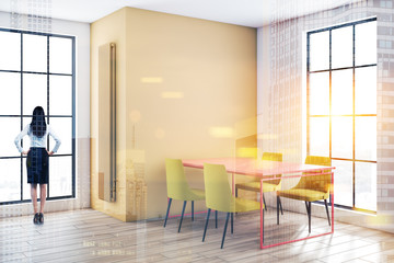 Fototapeta premium Woman in yellow and white dining room