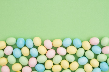 Candy Easter egg background green paper