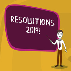 Word writing text Resolutions 2019. Business photo showcasing promise yourself to do or to not doing something this year Confident Man in Tie, Eyeglasses and Stick Pointing to Blank Colorful Board