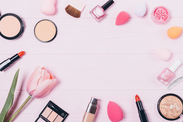 Obraz na płótnie Canvas Feminine beauty products on pink table