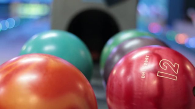 Close-up a group of colored bowling balls in the club