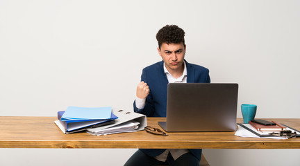 Business man in a office with angry gesture