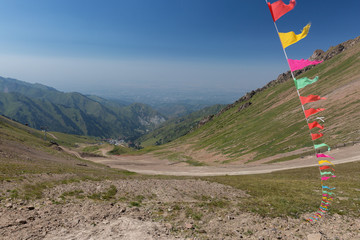 Fototapeta premium a pile of colorful flags high in the mountains