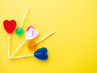 Several lollipops on a yellow background