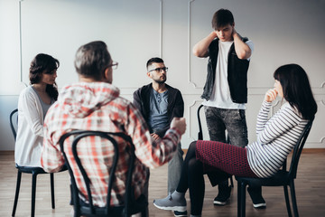 Support meeting with psychiatrist  for young addicts in rehab center