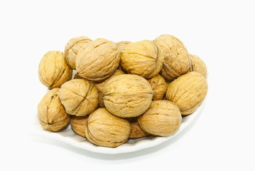  walnuts on the plate, white background