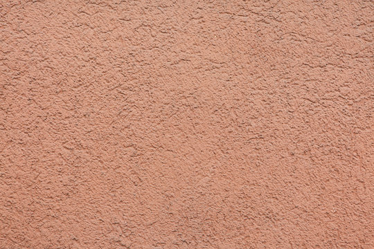Pink painted stucco wall. Background texture