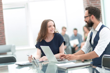 business colleagues sitting at a Desk in the office