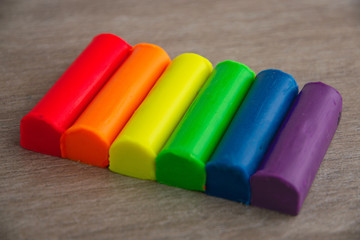 LGBT banner: pieces of colored plasticine laid out in order of colors of the flag of sexual minorities