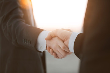 Obraz na płótnie Canvas close up.business handshake over blurry background.