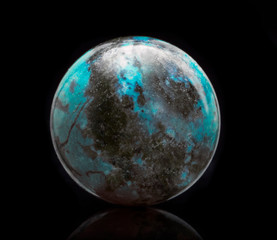 Mineral Unakite with reflection on black surface background