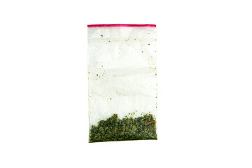 plastic bag with a synthetic narcotic drug of kanabioid origin, chemical marijuana, spice, isolated on white