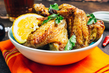 Chicken wings on barbecue grill.
