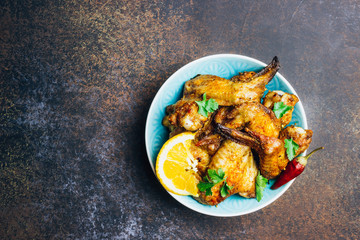 Chicken wings on barbecue grill.