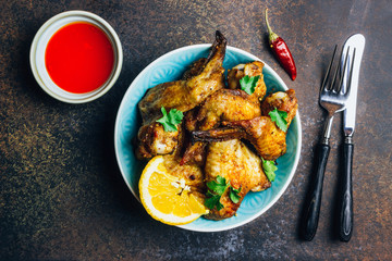Chicken wings on barbecue grill.