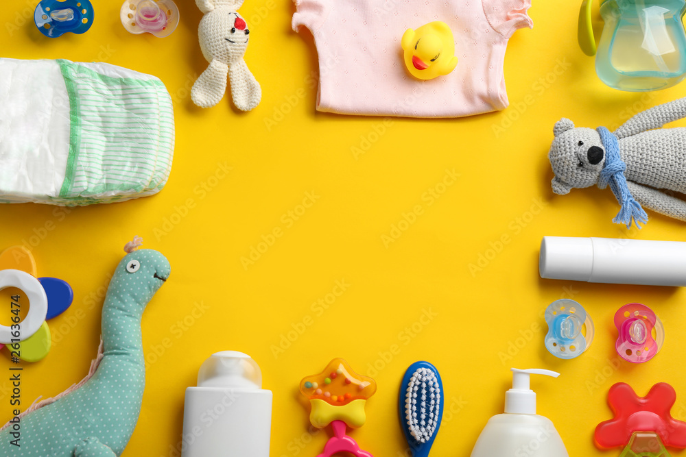 Wall mural flat lay composition with baby accessories and space for text on color background