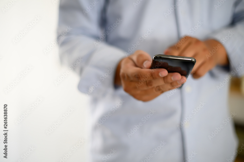 Poster manhands using a smartphone text work digital and communication concept