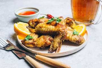 Chicken wings on barbecue grill.