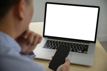 man working on his laptop with blank copy space Laptop with blank screen Mock up Blank screen computer