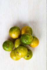 Spondias tuberosa (umbu) on textured background.