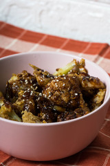 general tso cauliflower with chicken breast consist of fried cauliflower in sourly soy sauce 