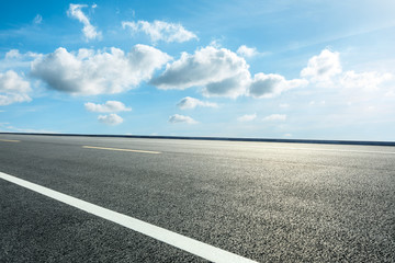 Empty asphalt road ground and blue sky with white clouds scene