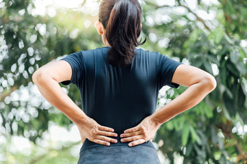 Young Asian women with back pain