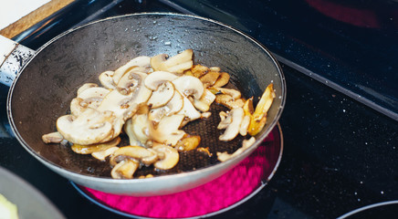 SAlting mushrooms in pan