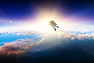 Astronaut in space on planet orbit.