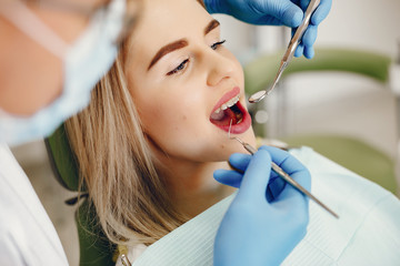 Beautiful lady in the dentist's office. Woman in a uniform