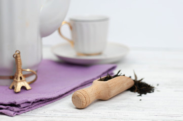 Obraz na płótnie Canvas Teapot and cups on the wooden white table. Aromatic black tea. Concept of tea ceremony, break and having rest.