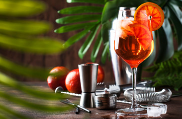 Aperol spritz cocktail in big wine glass with orange slices, summer cool fresh alcoholic cold...