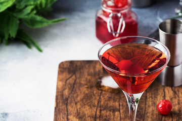 Classic alcoholic cocktail Manhattan with american bourbon, red vermouth, bitter, ice and cocktail...