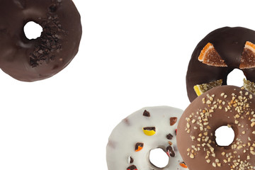 Different bright tasty donuts on a white background. Place under the text. Diversity.