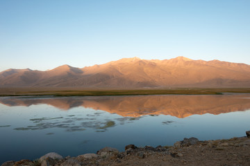Pamir Mountains, Tajikistan - Aug 22 2018: Morning Landscape of Bulunkul Lake in Gorno-Badakhshan, Tajikistan. It is located in the World Heritage Site Tajik National Park (Mountains of the Pamirs).