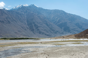 Pamir Mountains, Tajikistan - Aug 22 2018: Afghanistan and Panj river at Wakhan Valley View from...