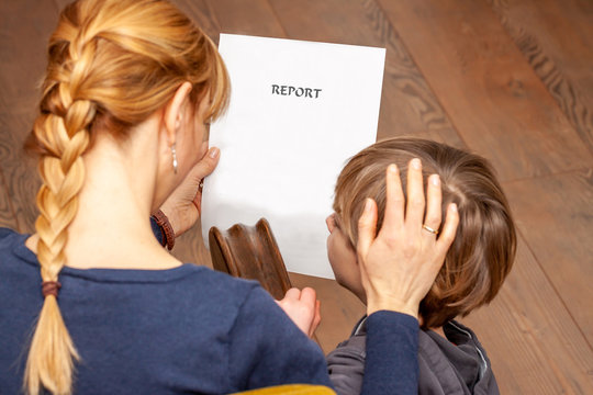 Mother Comforting Son Despite The Bad School Report