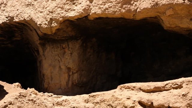 This world heritage site is located in the Bamyan Valley of Afghanistan.  Part of this site was destroyed in 2001 by the Taliban. Pan right. Tight shot. 