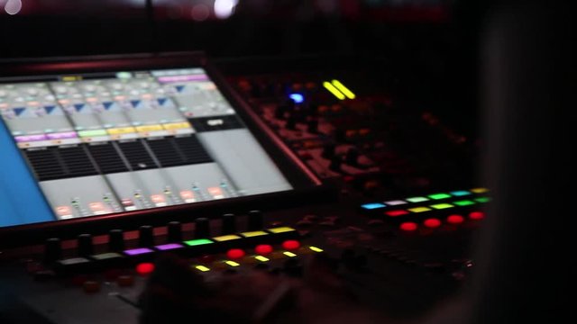 remote recordists closeup. Hand adjusts sound effects. Electric machine on table for working of sound designer or club dj at party in nightclub. Occupation for modern lifestyle, objects for listen at 