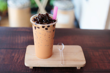 Ice bubble milk tea in takeaway glass.